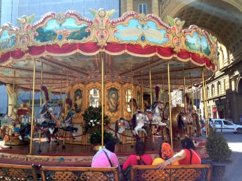 Colorful carousel in Florence, Italy via MontgomeryFest